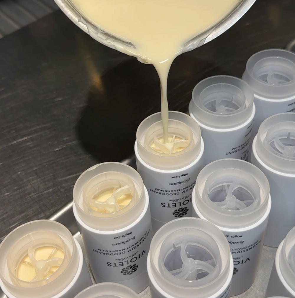 Pouring the Violets Are Blue Magnesium Deodorants in small batches at the Blissoma herbal studio